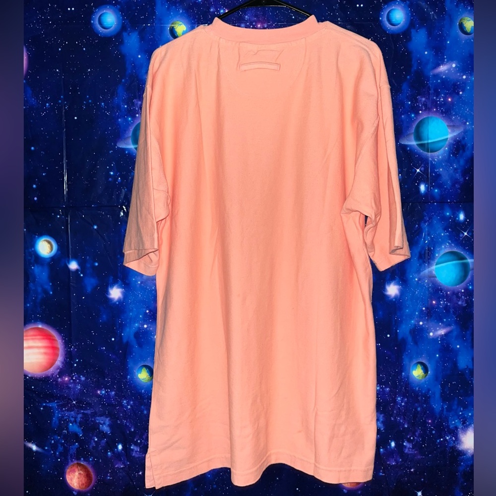 A salmon pink oversized shirt

WEK UP!! You need this in your life!